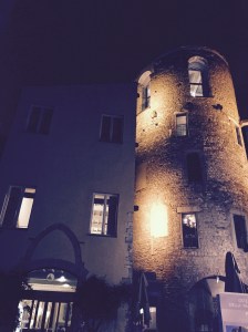 Our hotel, lit at night.